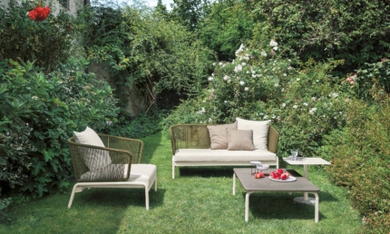 Suro teak and braided rope outdoor sofa with neutral cushions`