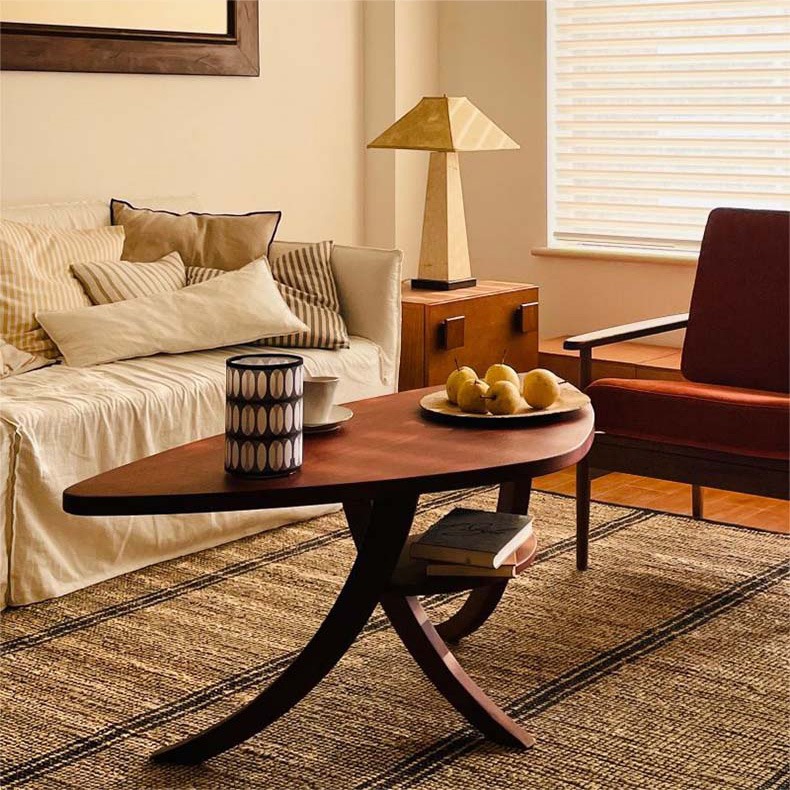Chunsh solid wood coffee table with curved legs in a warm living room