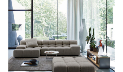 Puffs grey sectional sofa in a bright living room
