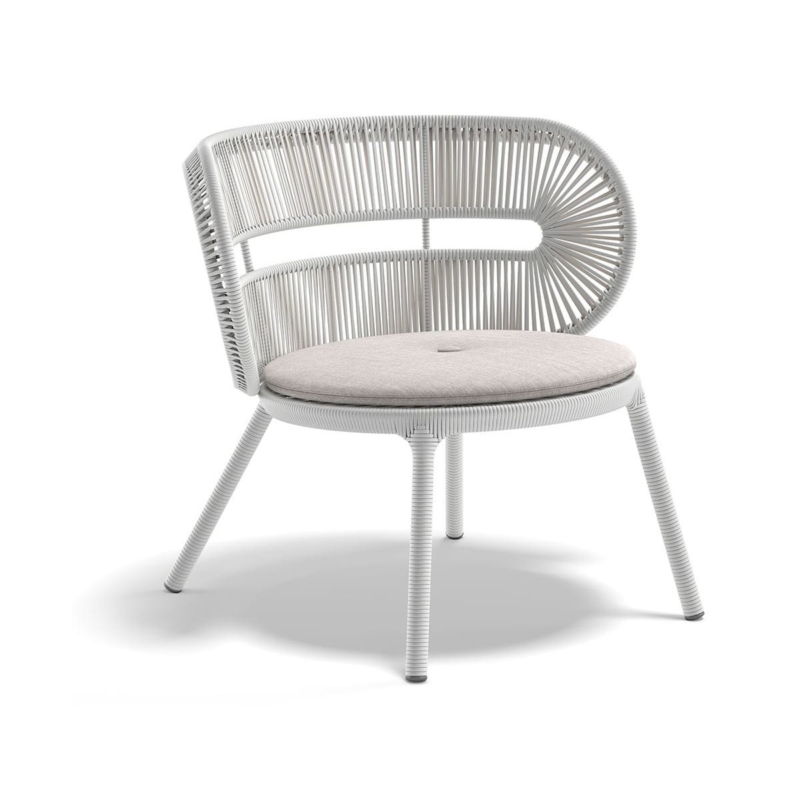 Halo woven outdoor lounge chair in Twilight with a light seat cushion