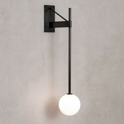 Black globe wall lamp with a triangular wall bracket and long vertical stem.
