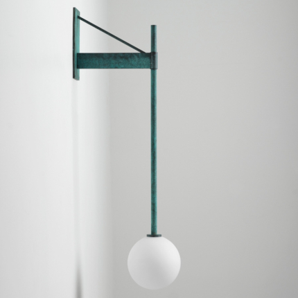 Verdigris green globe wall lamp with a geometric bracket and white spherical shade.