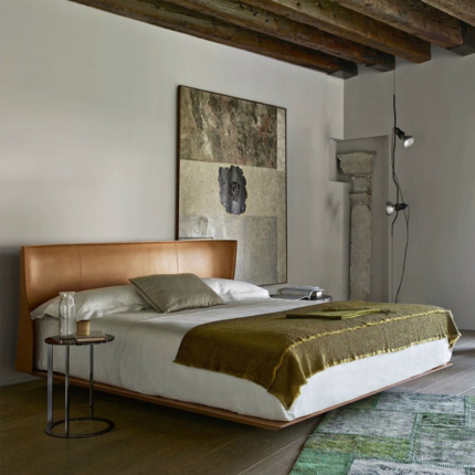 Haven upholstered bed with a curved headboard in a bedroom