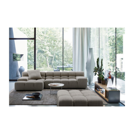 Puffs grey sectional sofa in a bright living room