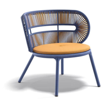 Halo woven outdoor lounge chair in Sunrise with an orange seat cushion
