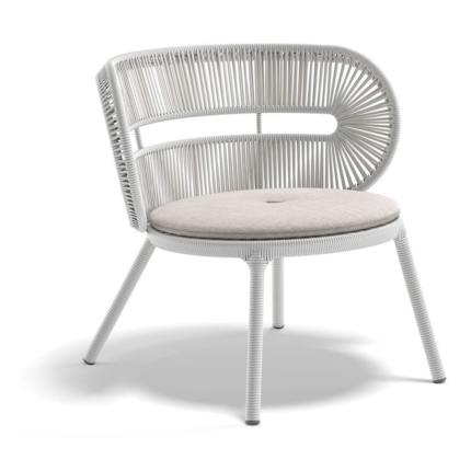 Halo woven outdoor lounge chair in Twilight with a light seat cushion