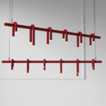 Front and angled views of the wine-red Arcus linear chandelier