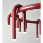 Close-up of wine-red curved metal arms and illuminated LED tips