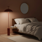 Dark red Doma floor lamp beside a bed