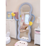 Hug Blue Gingham Floor Mirror with one yellow mitten hand raised