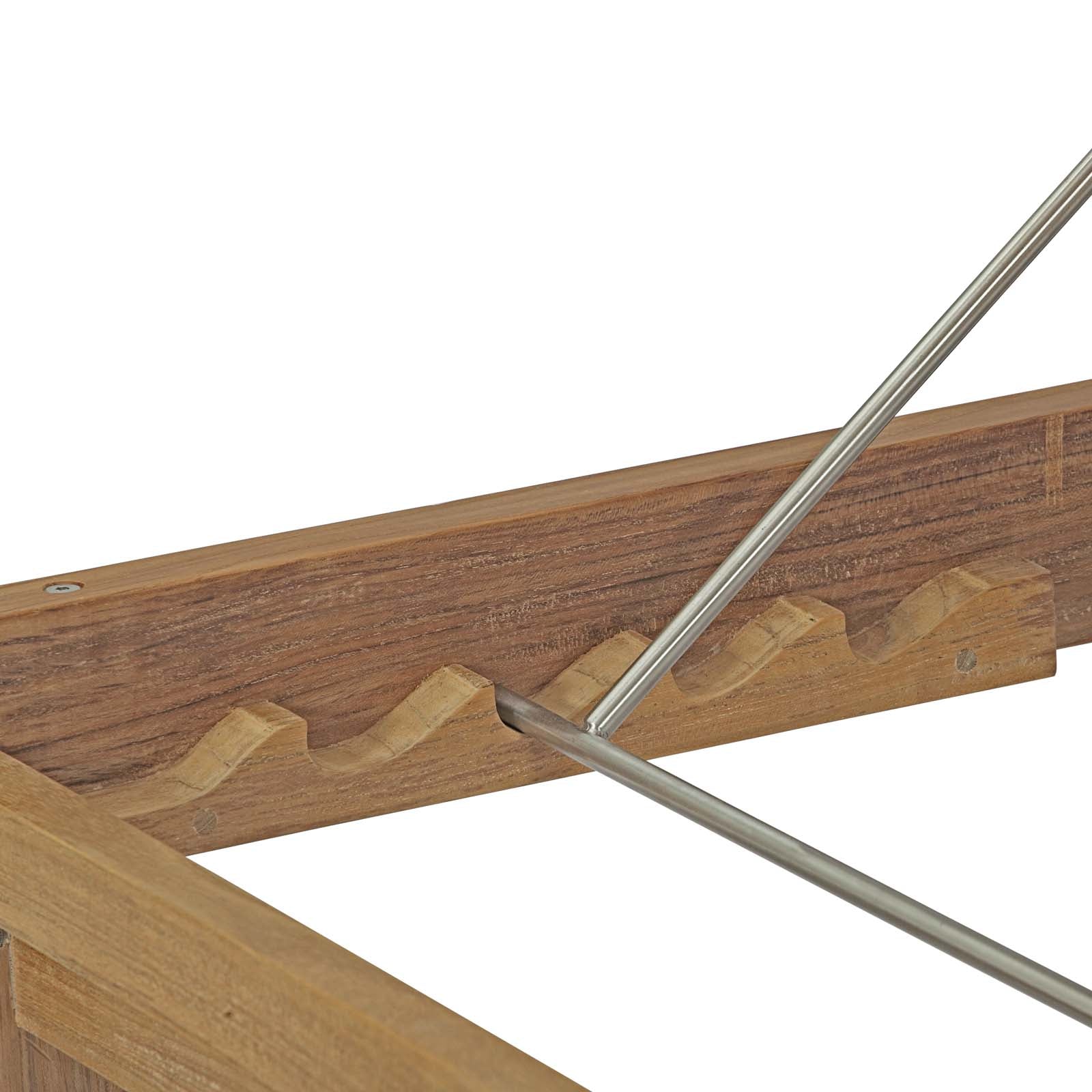 Close view of the notched timber rail and metal backrest support on the reference chaise.