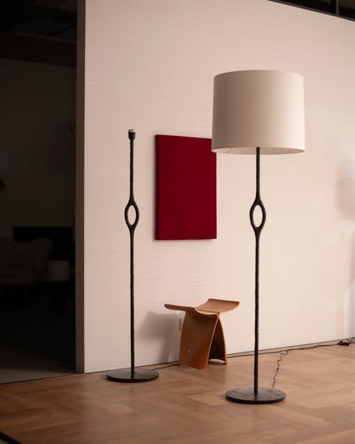 Slender dark floor lights with pale shades in a BUNISE Instagram room photograph