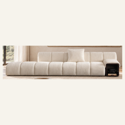 Terracotta curved sofa with banded upholstery in a cream living room.